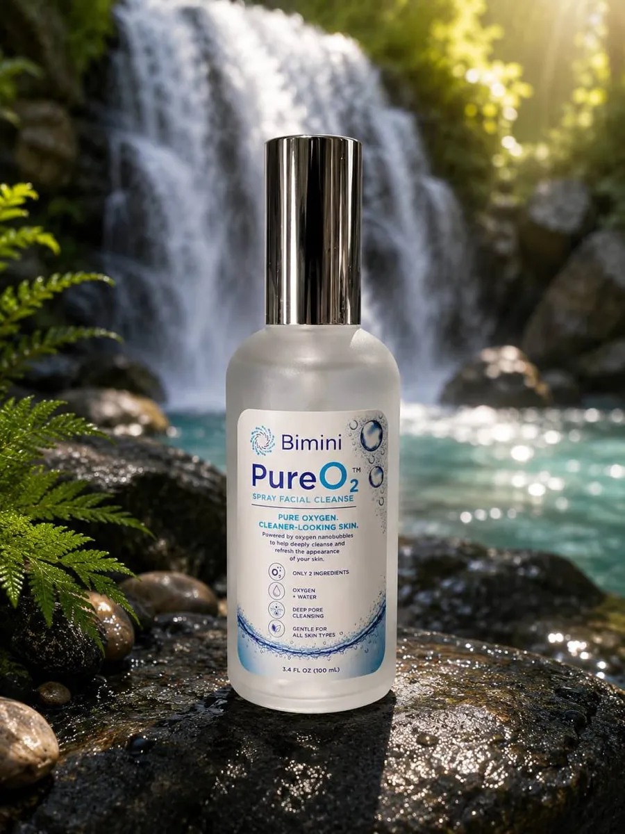 Bimini Pure O2 Spray on a rock in front of a waterfall
