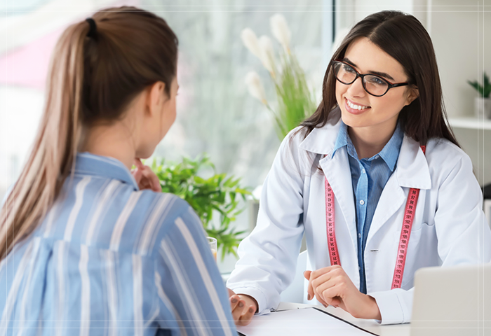 doctor speaking with a lady