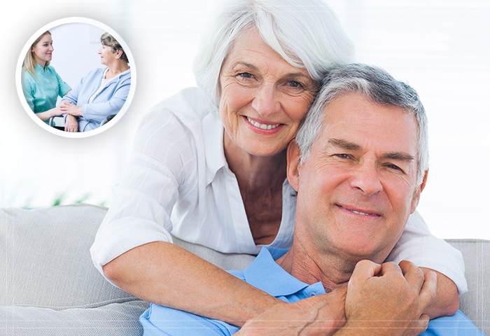 elderly women hugging a man from behind